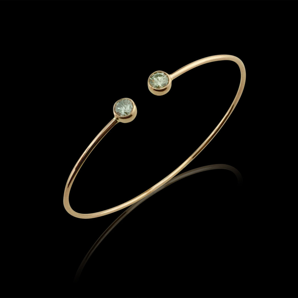 Rose Gold Bangle Featuring Two Round Brilliant Cut Diamonds