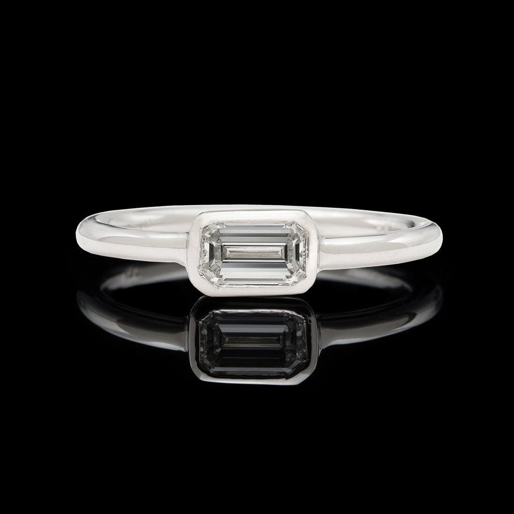 18kt White Gold Ring Featuring Horizontal Set Emerald Cut