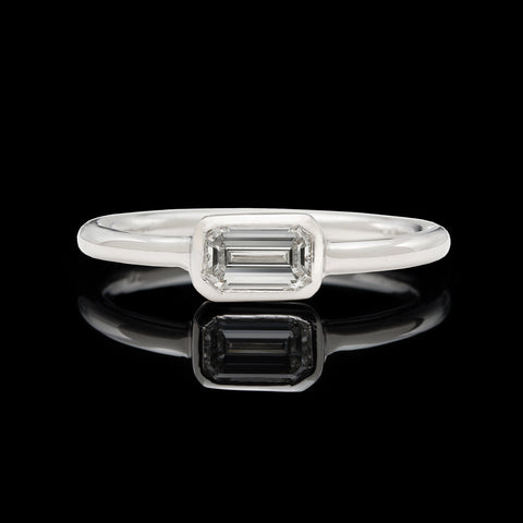 18kt White Gold Ring Featuring Horizontal Set Emerald Cut