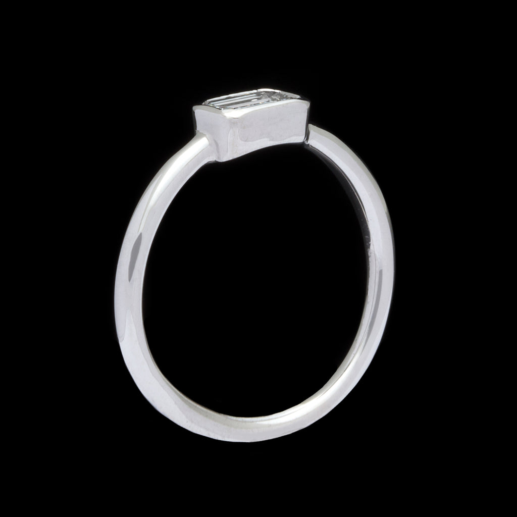 18kt White Gold Ring Featuring Horizontal Set Emerald Cut