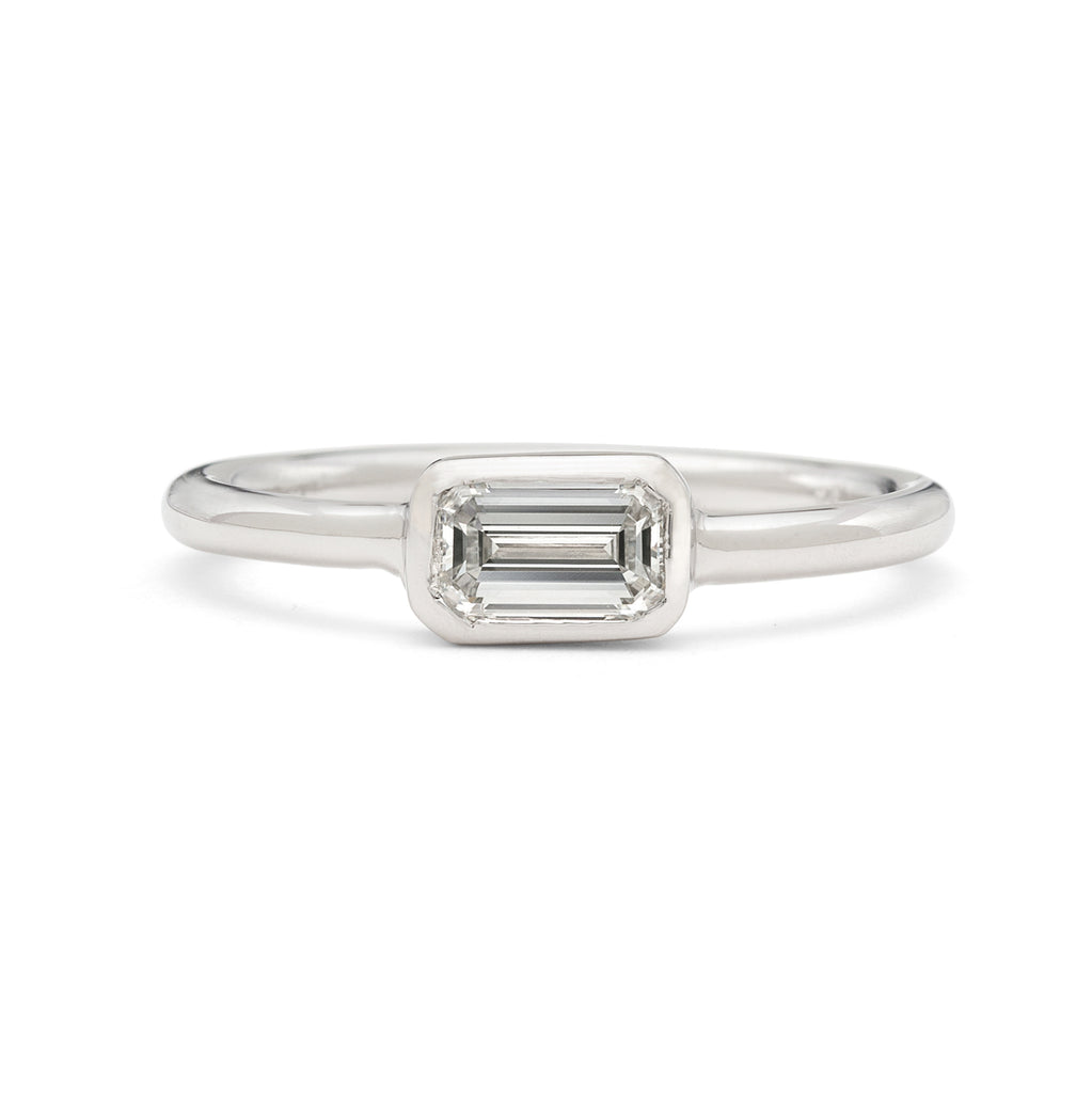 18kt White Gold Ring Featuring Horizontal Set Emerald Cut