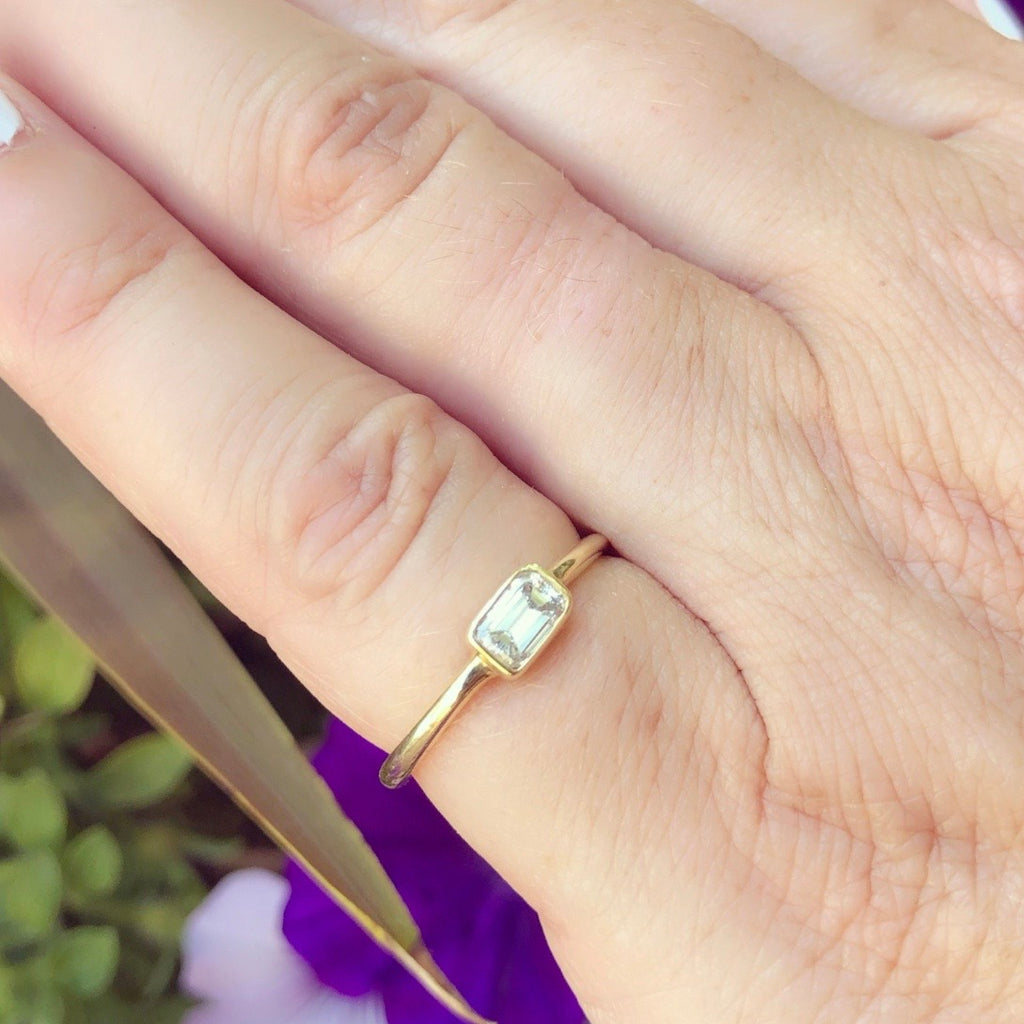 18kt Yellow Gold Ring Featuring Horizontal Set Emerald Cut
