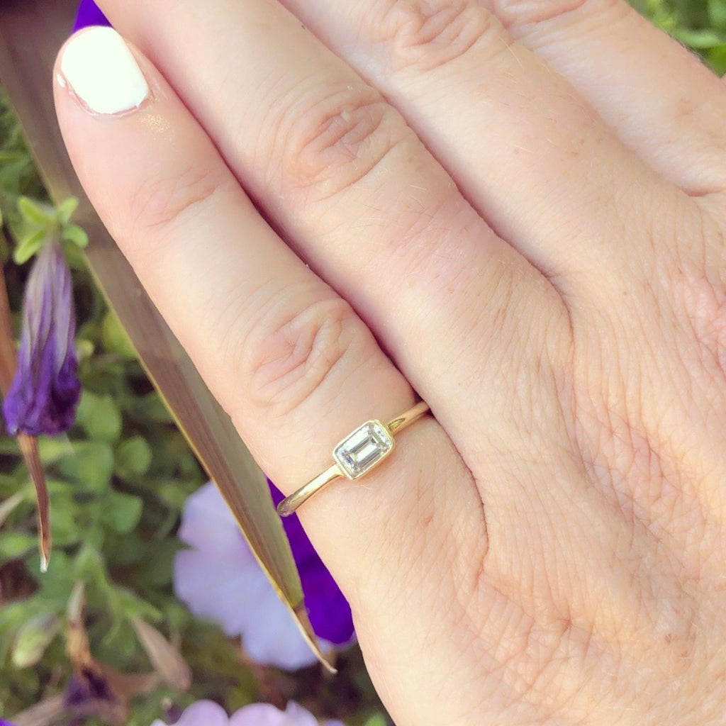18kt Yellow Gold Ring Featuring Horizontal Set Emerald Cut