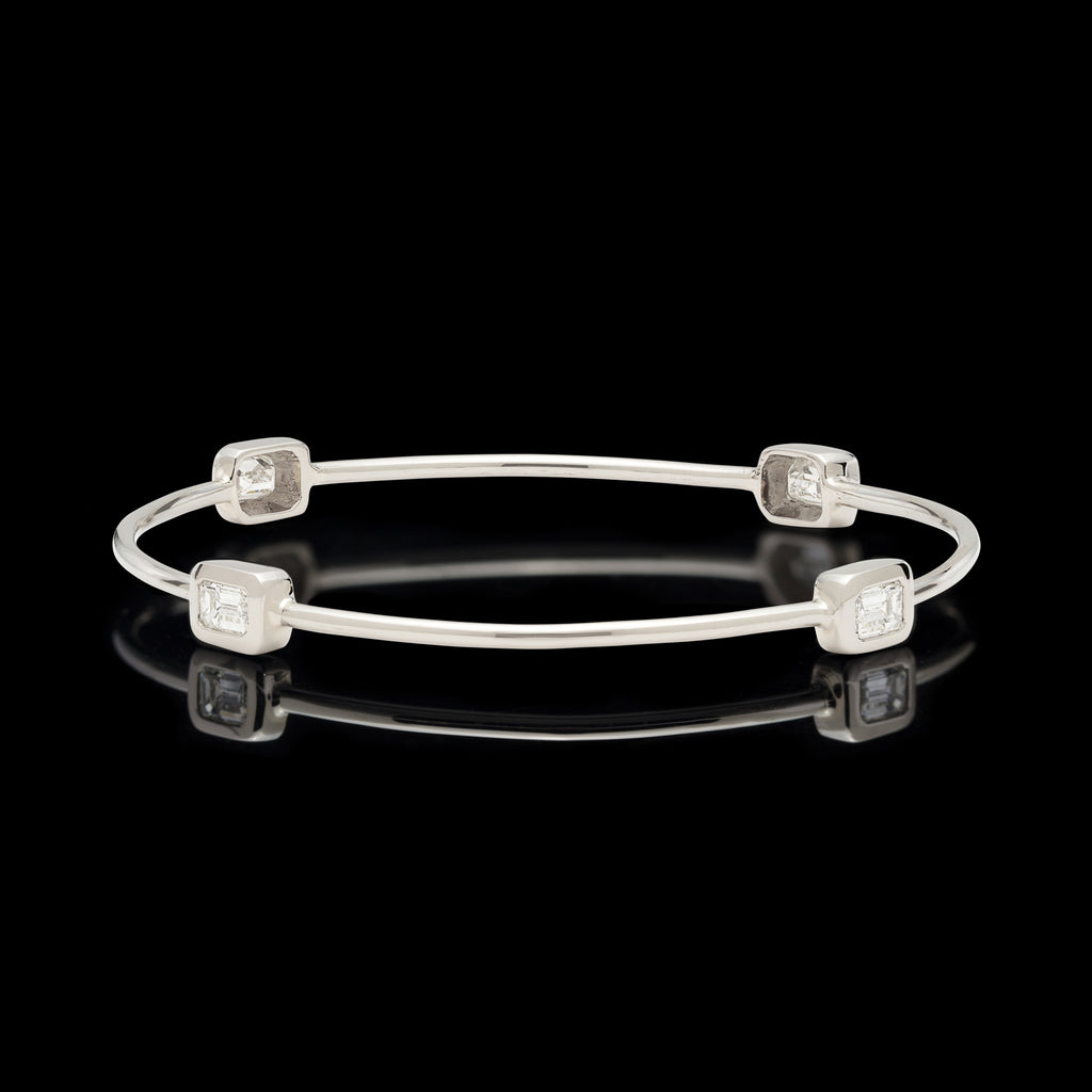 White Gold Bangle Featuring Four Emerald Cut Diamonds