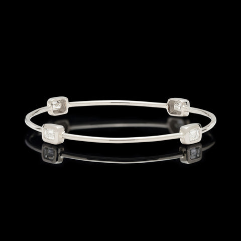 White Gold Bangle Featuring Four Emerald Cut Diamonds