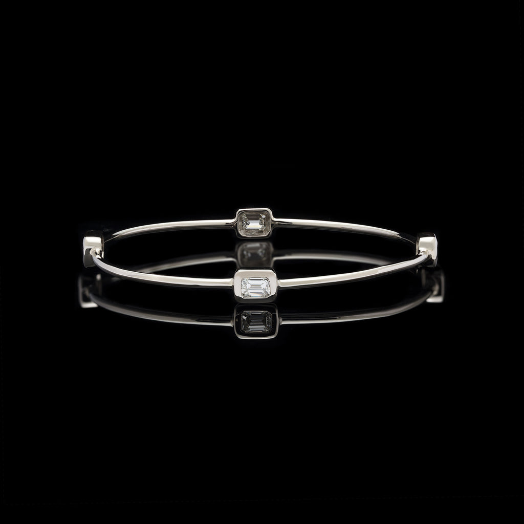 White Gold Bangle Featuring Four Emerald Cut Diamonds