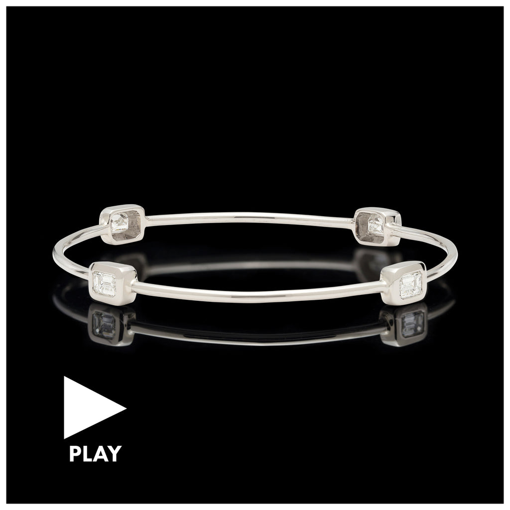 White Gold Bangle Featuring Four Emerald Cut Diamonds
