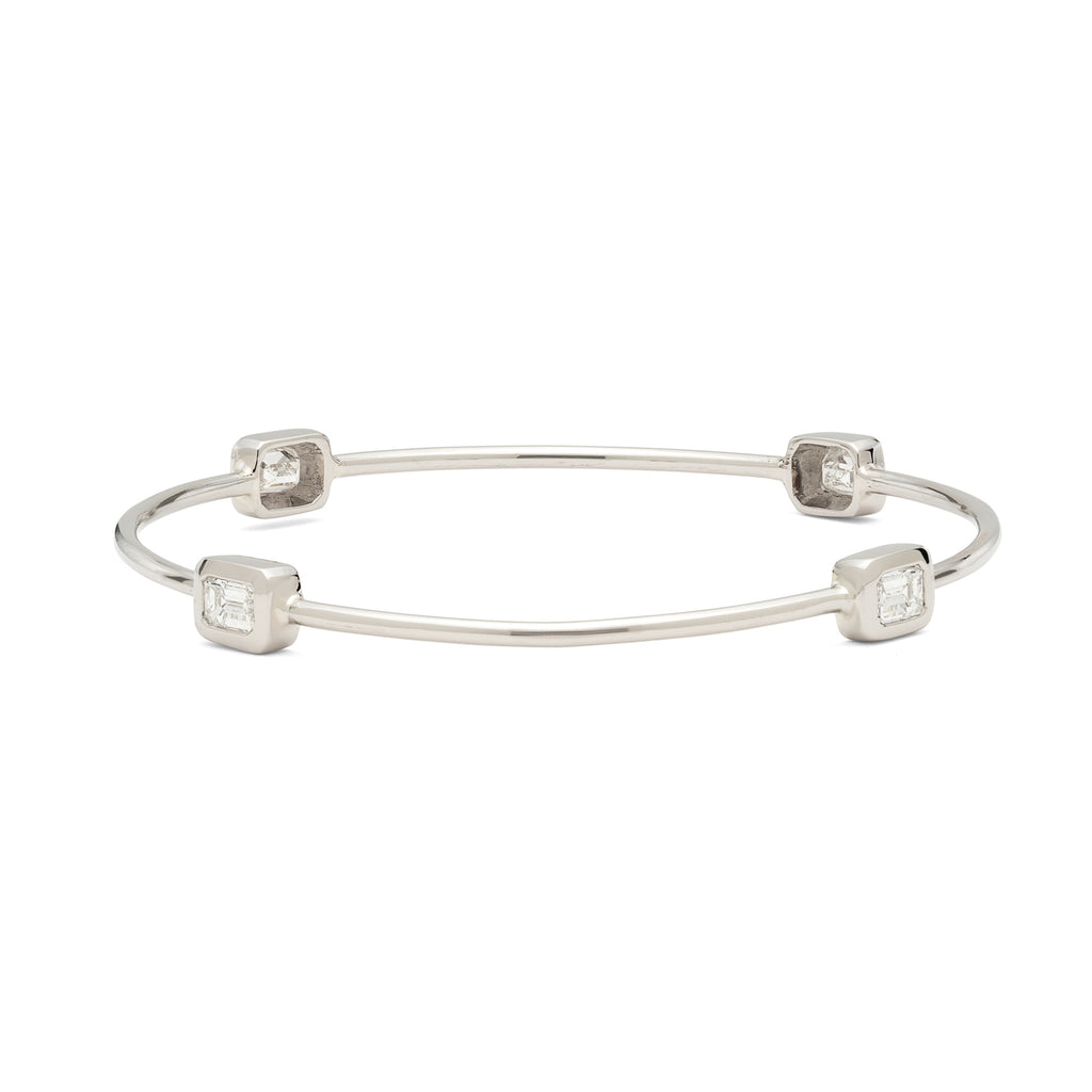 White Gold Bangle Featuring Four Emerald Cut Diamonds